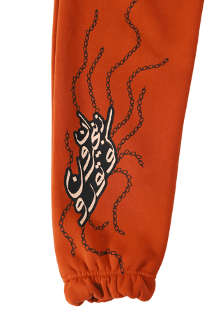 "ENLIGHTENMENT" RUST SWEATPANTS