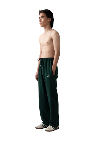 Rastah emerald green heavyweight terry knit sweatpants with a relaxed straight-leg fit and minimal logo embroidery.